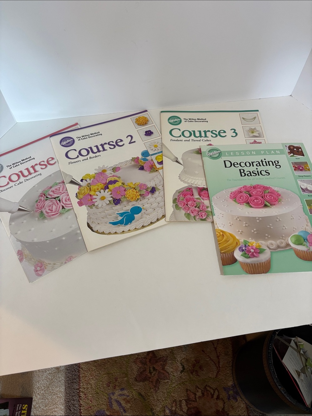 Wilton cake decorating course books.